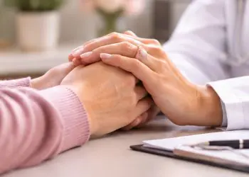 Healthcare provider offering compassionate support to a patient